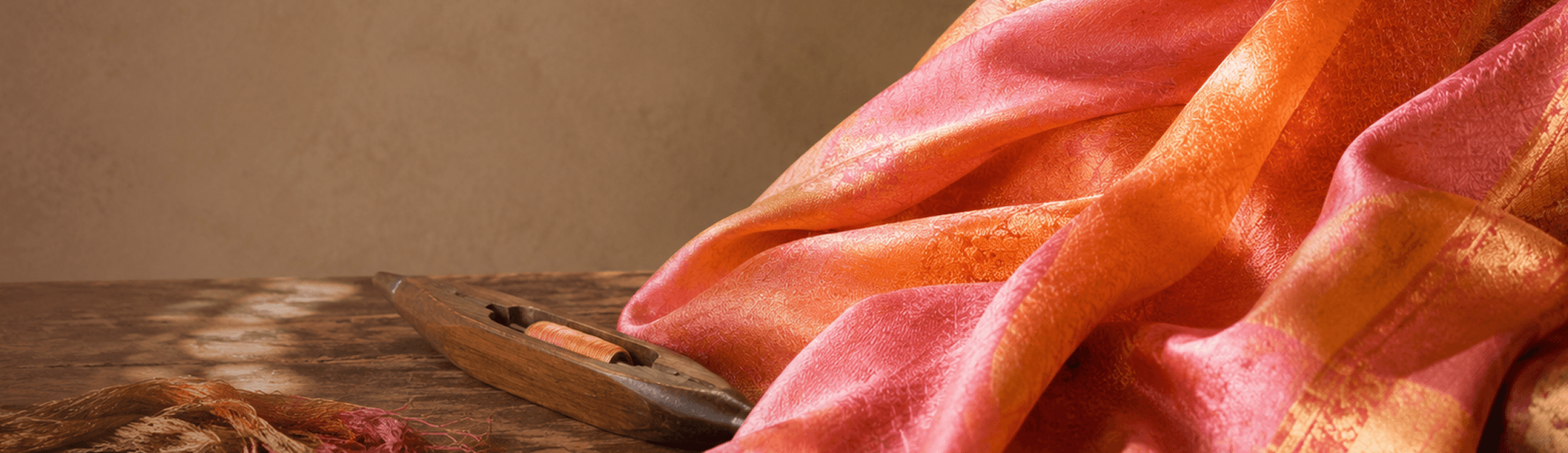 Silk saree draped over a wooden loom shuttle
